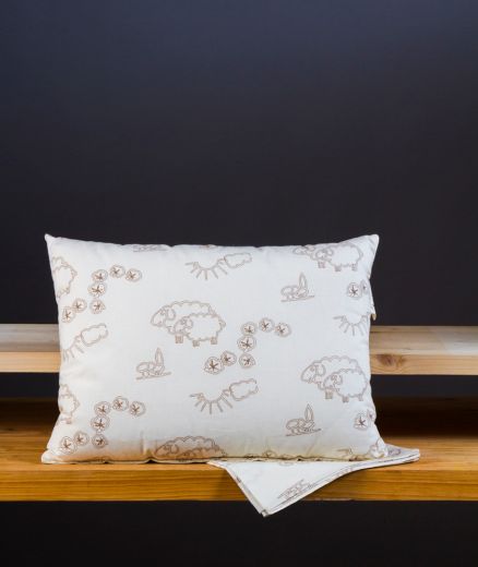 Oreiller de voyage écologique en laine, conçu avec des matériaux naturels et durables.